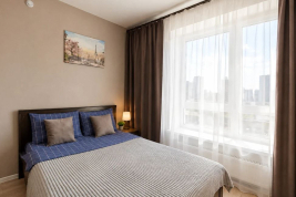 Кровать в номере New studio na Larushina в The LOFT STUDIO Moscow