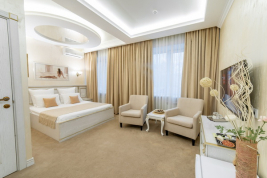 Кровать в номере Делюкс в отеле Инвайт Коломенская