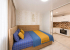 Кровать в апартаментах 4 в Loft Studio