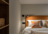 Двуспальная кровать в номере Studio Suite в Prive Luna