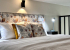 Кровать в номере Studio Suite в Prive Luna